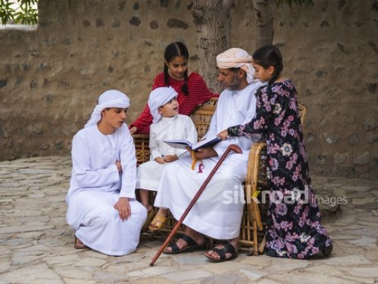 Kids engaging with grandfather|-