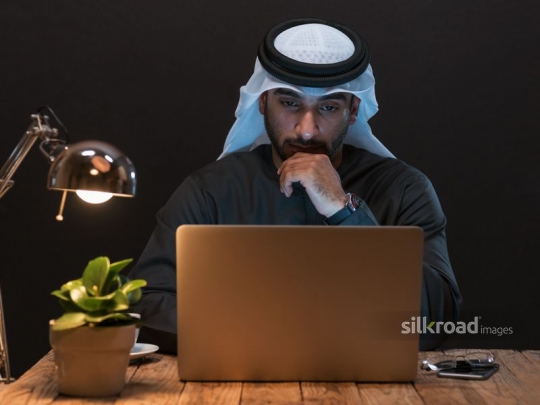Arabian man working up late