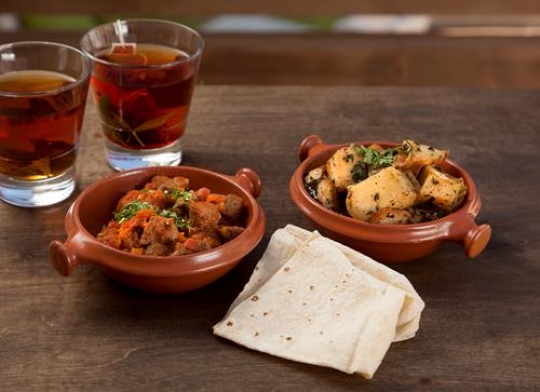 two cups of tea with a ful mudammas and potatoes for breakfast