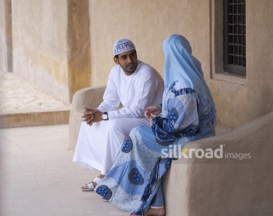 Couple in a conversation outside|-