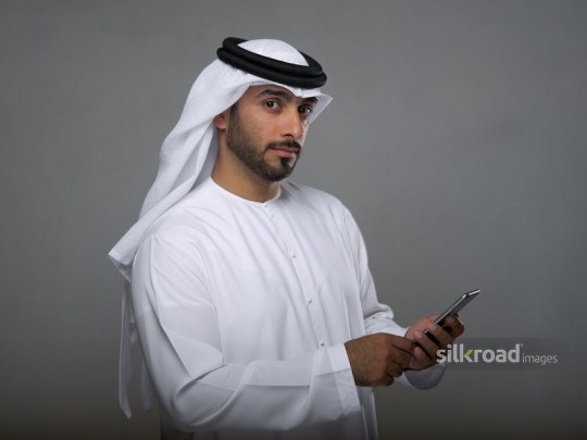 Arabian man using his mobile phone