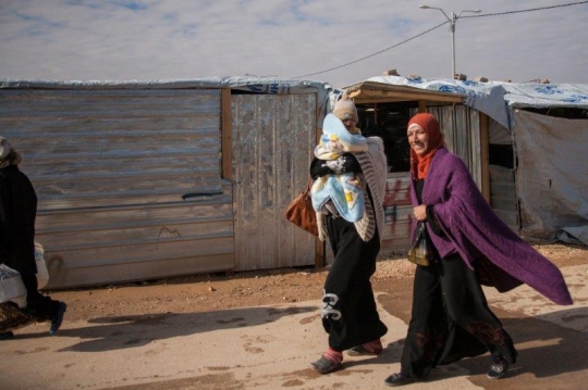 refugees walking in the camp