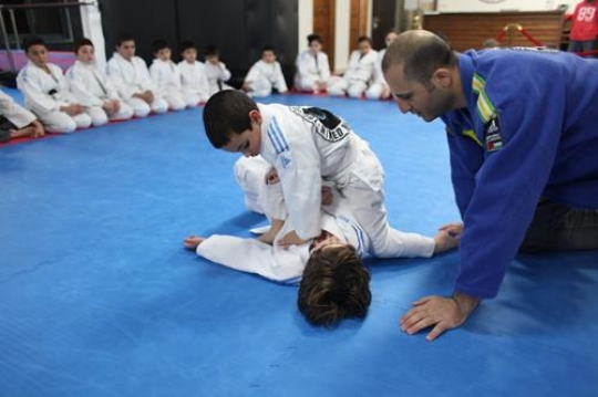 Children in a gym in martial arts training exercising karate, karate fighting Center