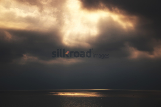 Dramatic Sky and Sea Landscape with Sunlight Reflections