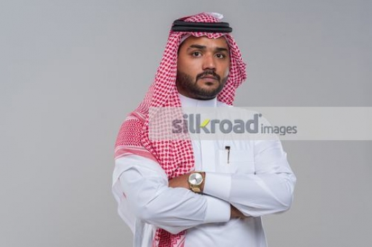 Medium shot of a Middle Eastern Businessman arms crossed |