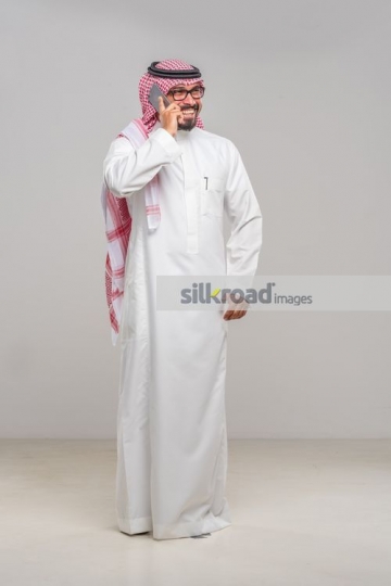 Middle Eastern Businessman talking on the phone|