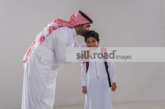 Arab man and young kid bonding|
