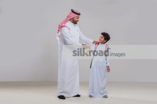 Middle Eastern man and young kid bonding|