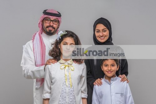 Middle Eastern family taking photo together