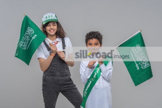 Middle Eastern kids proudly celebrating their country 