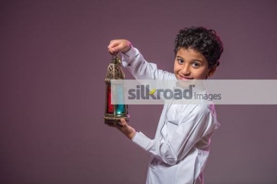 Boy carrying the Ramadan Lantern|