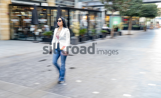 Dynamic Panning Shot of a Woman Walking at Amman’s Abdali Boulevard