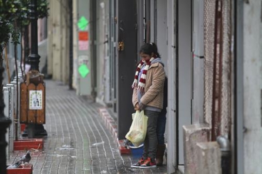 woman standing on pavement,palestine