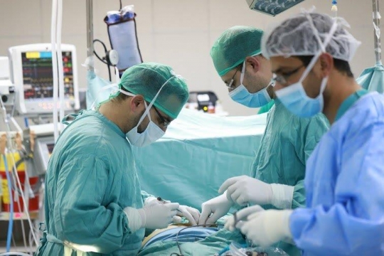 Surgeons Running an Operation