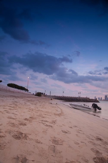 foot steps on the beach at sunset