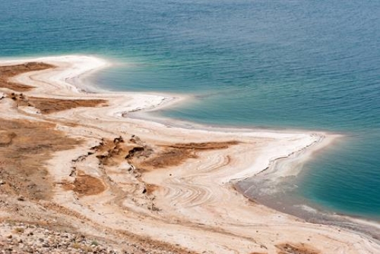 Crystalic salt on a rocks near beach in the Dead Sea, Jordan