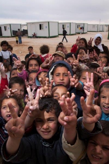 group of kids showing V sign from Zaatari refugee camp for Syrian refugees