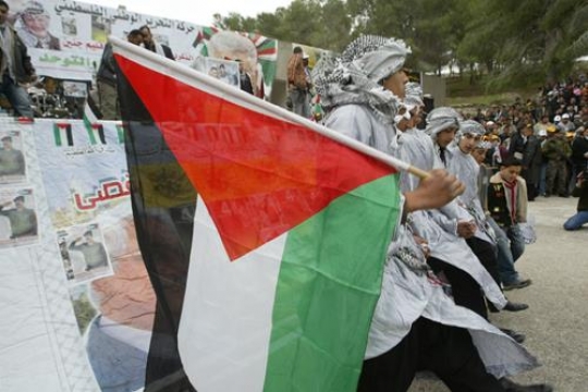 Palestinian Carrying Flag 