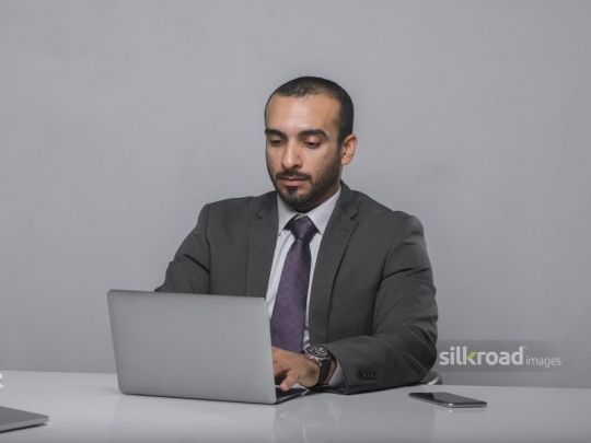 Businessman behind his laptop