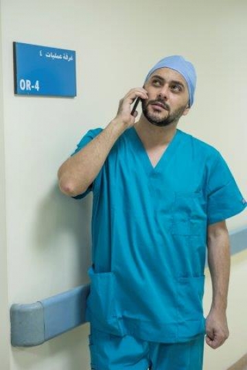 A Surgeon Making a Phone Call 