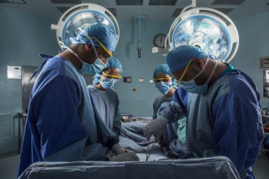 Surgeons Running an Operation