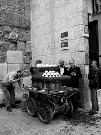 men gathering around a cart