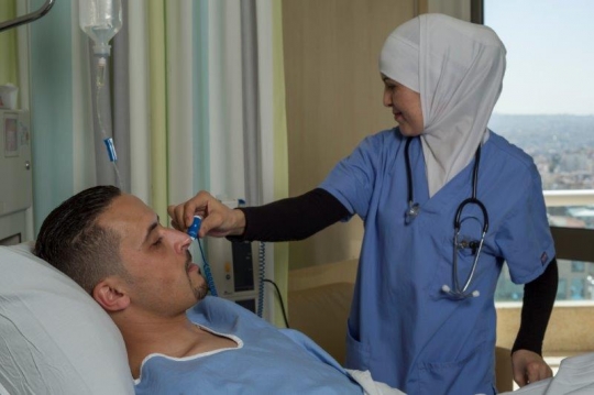 A Nurse Checking on Patient at