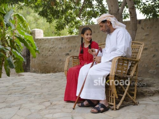 Grandfather in conversation with girl|-