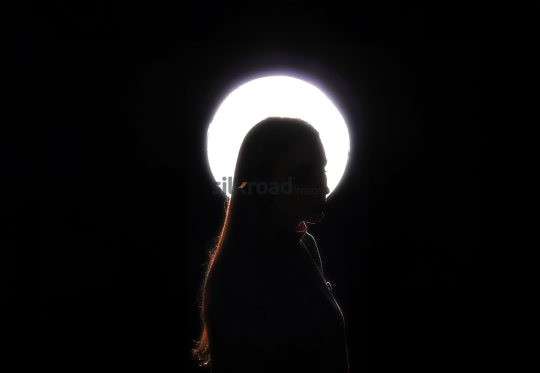 Fine Art Portrait of a Woman with Backlight in Artistic Silhouette