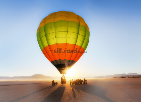 Hot Air Balloon Soaring Over Wadi Rum Desert at Sunrise