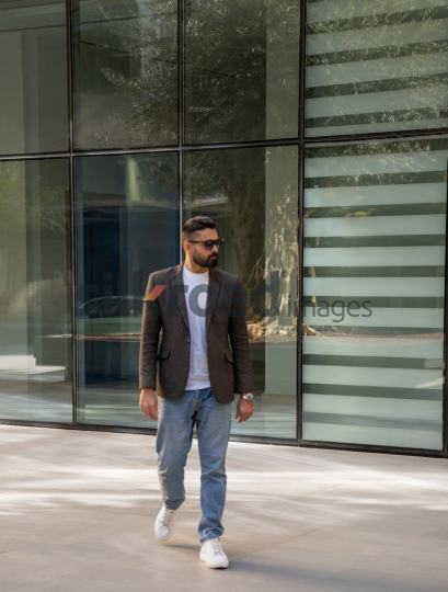 Professional Man Exiting Corporate Building