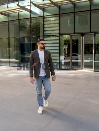 Professional Man Exiting Corporate Building
