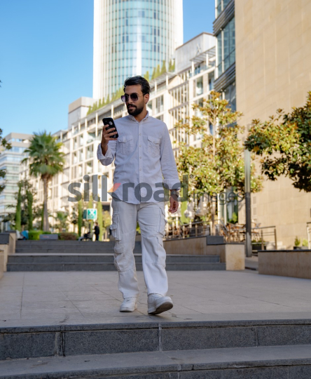 Professional Man Walking Through Al Abdali Boulevard, Amman