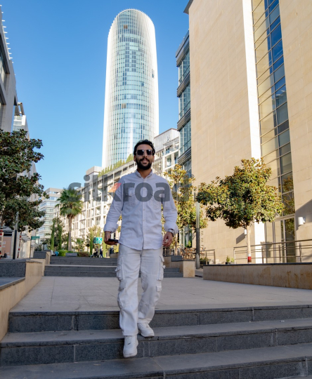 Professional Man Walking Through Al Abdali Boulevard, Amman