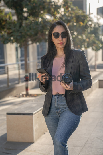 Professional Woman Enjoying Morning Coffee in Al Abdali Boulevard