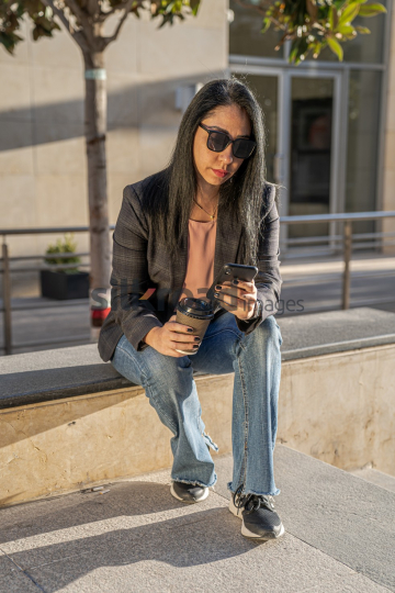 Professional Woman Enjoying Morning Coffee in Al Abdali Boulevard