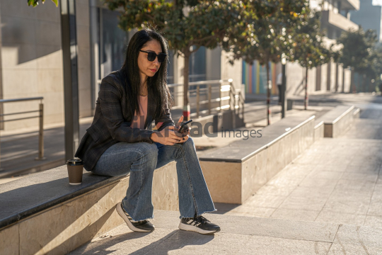 Professional Woman Enjoying Morning Coffee in Al Abdali Boulevard