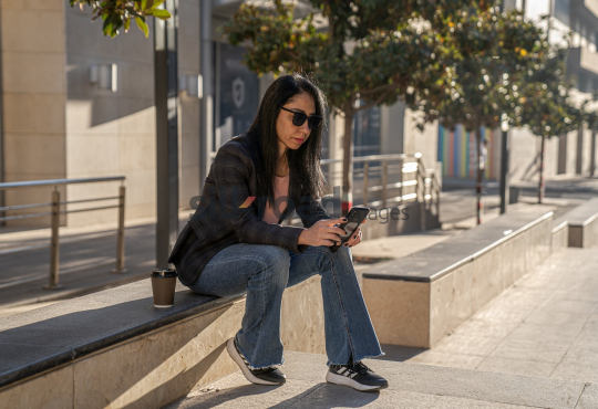 Professional Woman Enjoying Morning Coffee in Al Abdali Boulevard