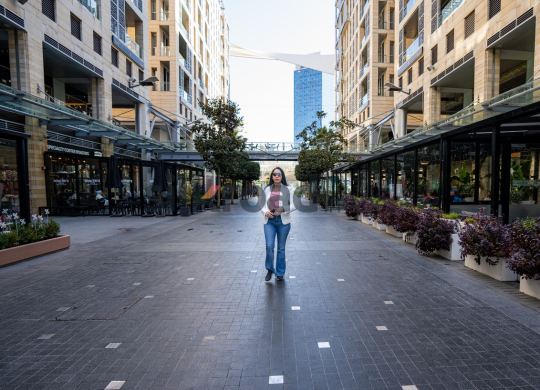 Professional Woman Walking to Work on Al Abdali Boulevard, Amman