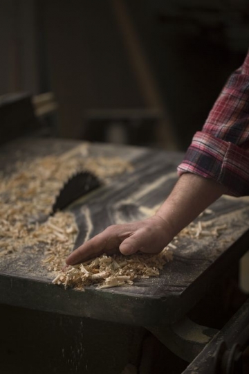Removing the wood dust from the table
