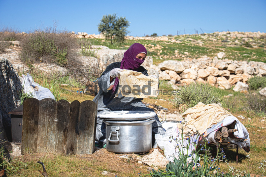 Rural Woman Making Traditional Bread Outdoors - A Cultural Scene