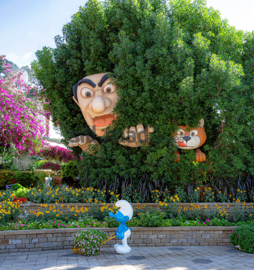 Smurf in Dubai's Flower Garden with Playful Sculptures