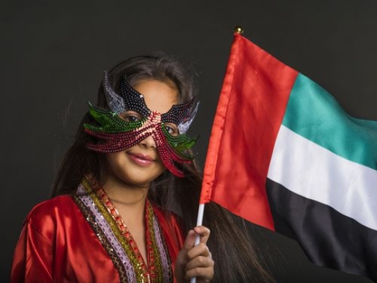 Middle Eastern girl celebrating National Day|