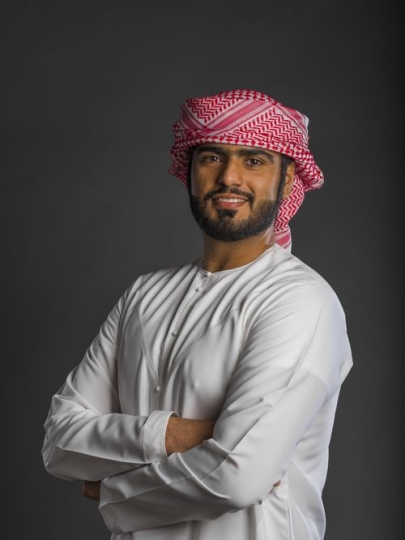 Middle Eastern man standing arms crossed