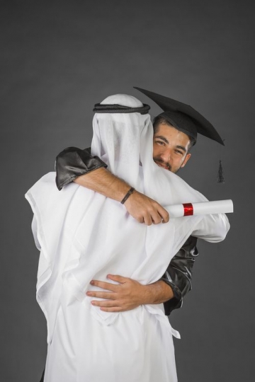 An Arab dad and son hugging