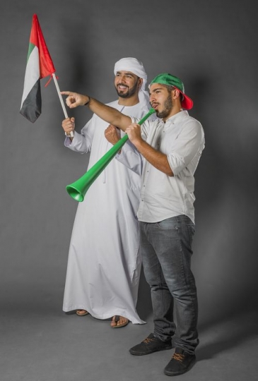 Two men celebrating National Day