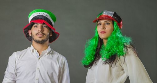 Middle Eastern man and woman representing the UAE National Day