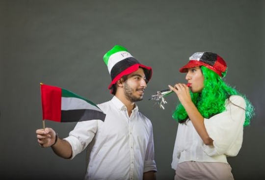 Arab man and Arab woman celebrating the UAE National Day together