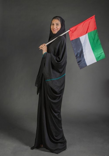 Woman carrying a UAE Flag