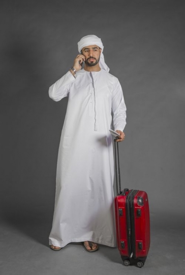 Middle Eastern Businessman having a phone call|-